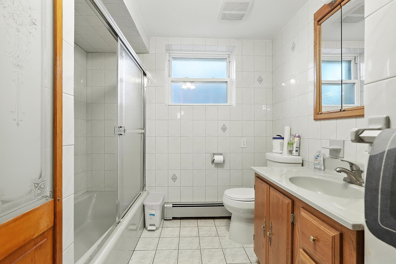 961 Avenue C Bayonne, NJ 07002 - Photo 16 of 21 a bathroom with a sink a toilet and shower