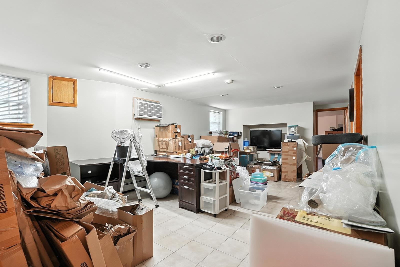 961 Avenue C Bayonne, NJ 07002 - Photo 19 of 21 a living room with furniture and a flat screen tv