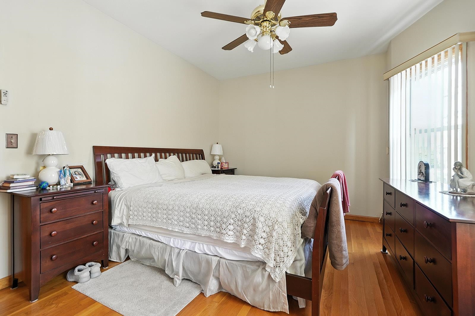 961 Avenue C Bayonne, NJ 07002 - Photo 21 of 21 a bedroom with a bed and a chandelier
