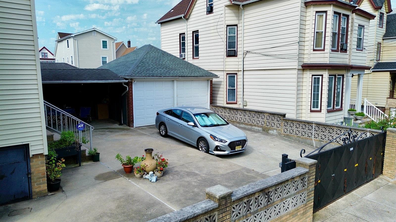 961 Avenue C Bayonne, NJ 07002 - Photo 5 of 21 a front view of a house with many windows