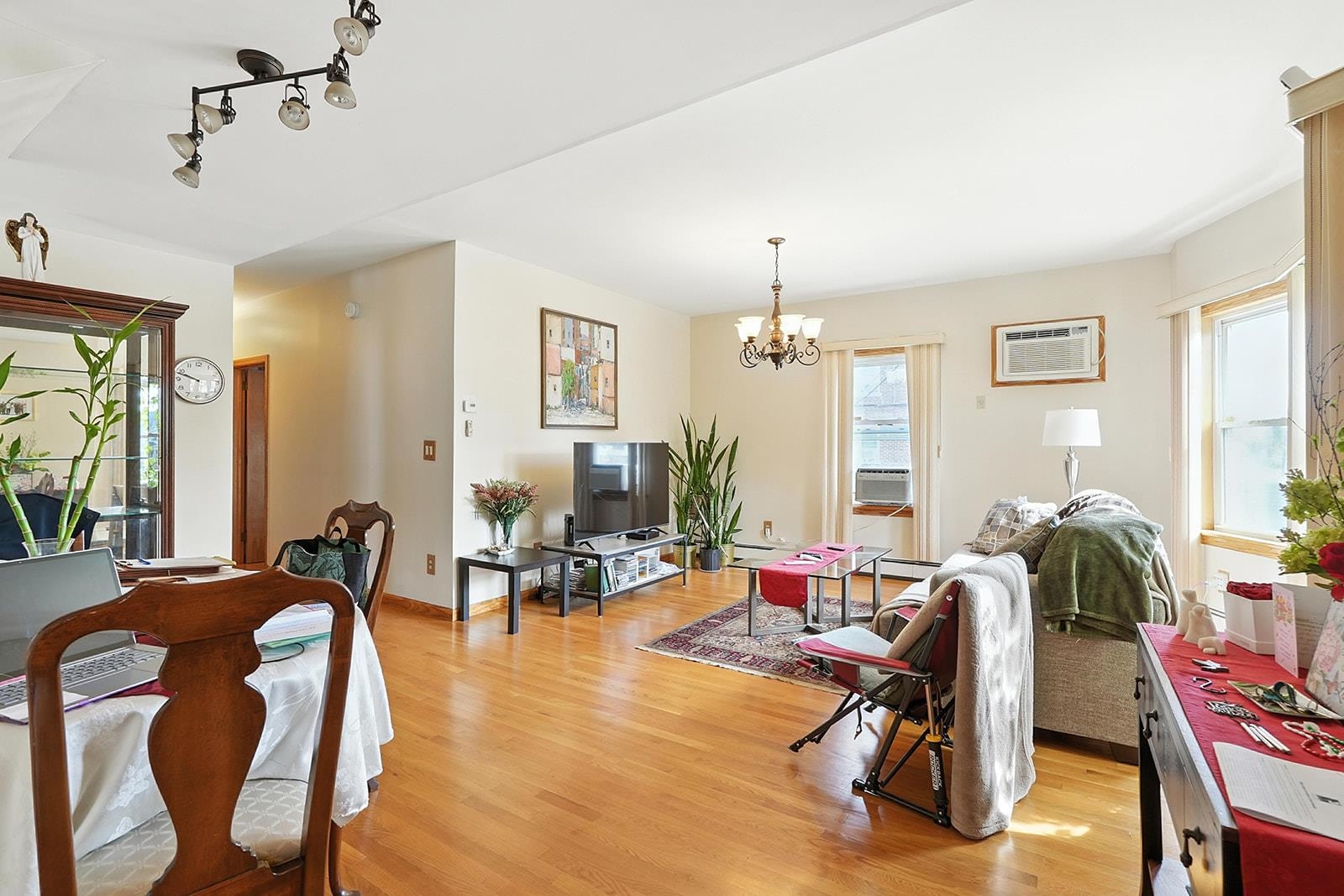 961 Avenue C Bayonne, NJ 07002 - Photo 7 of 21 a living room with furniture a flat screen tv and a window
