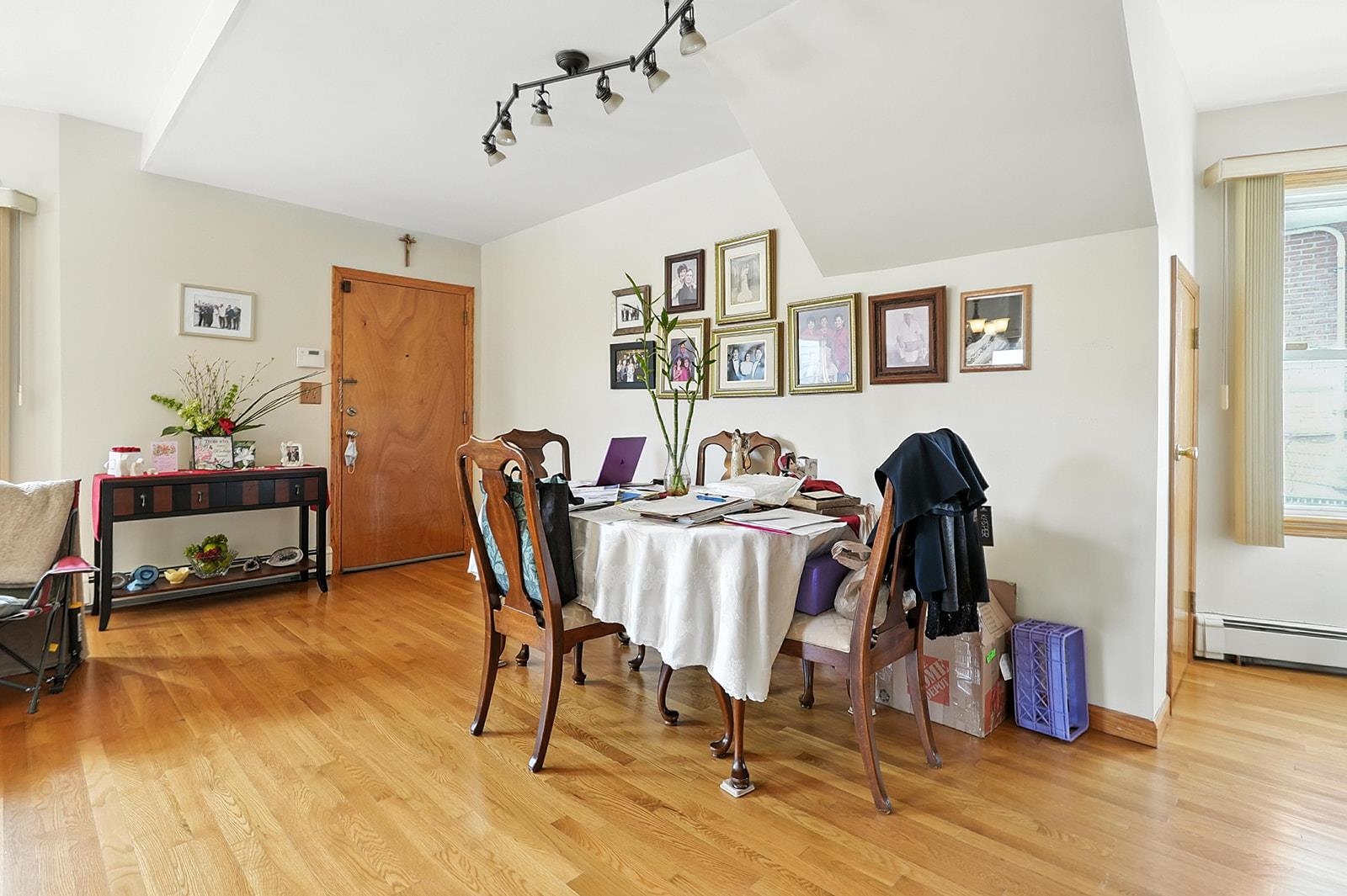961 Avenue C Bayonne, NJ 07002 - Photo 8 of 21 a view of a dining room with furniture and wooden floor