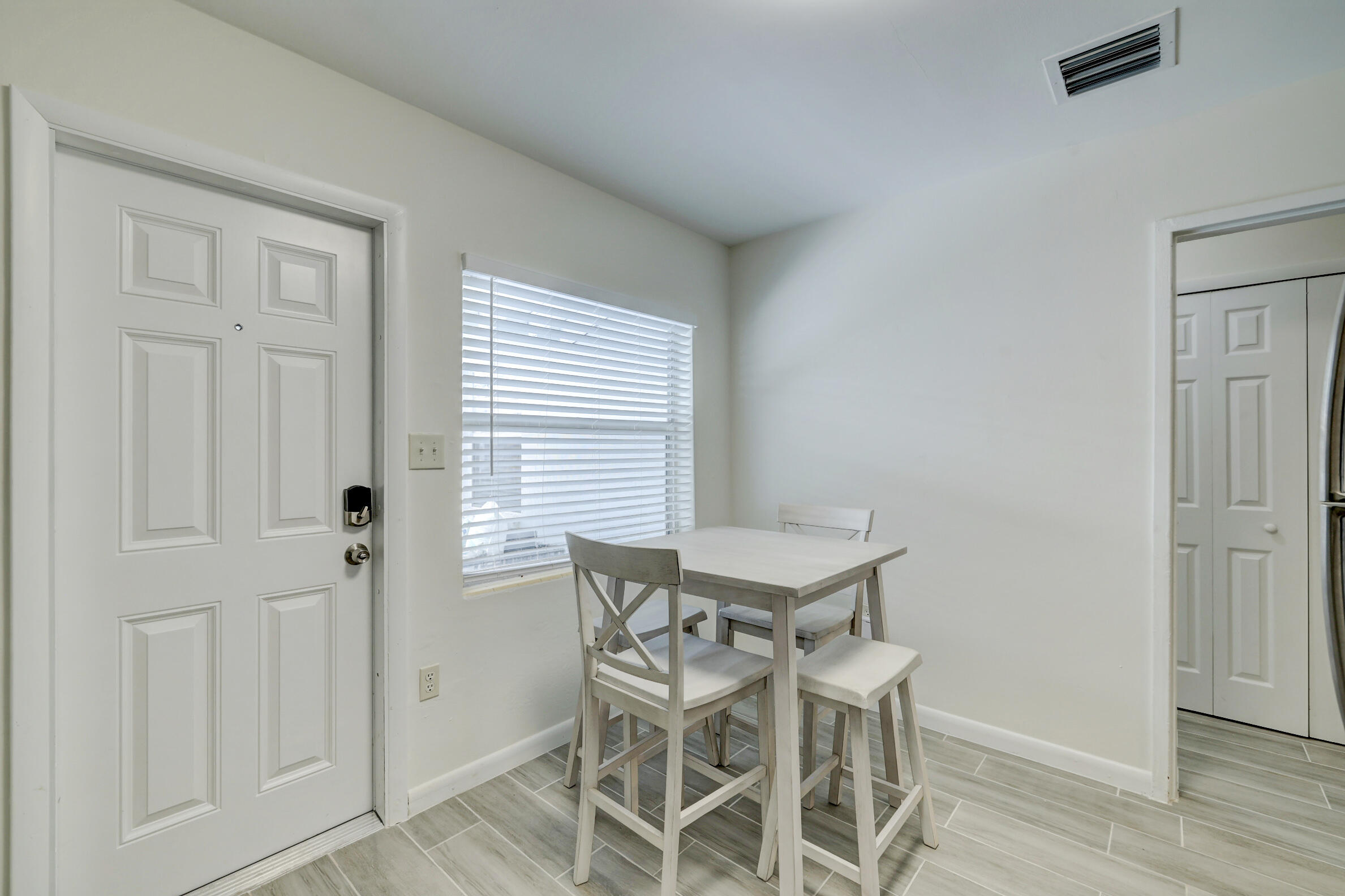 125 South 10th Street Fort Pierce, FL 34950 - Photo 11 of 30 a view of a dining room with furniture and wooden floor