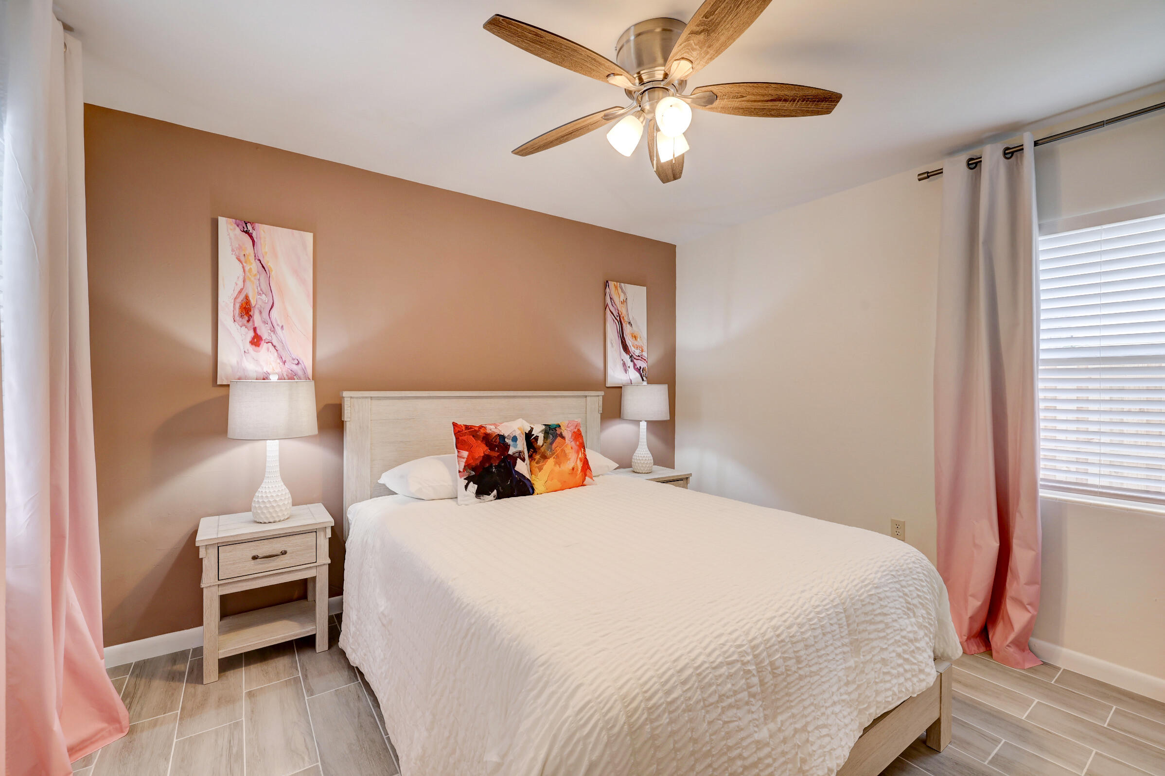 125 South 10th Street Fort Pierce, FL 34950 - Photo 14 of 30 a bedroom with a bed and a chandelier