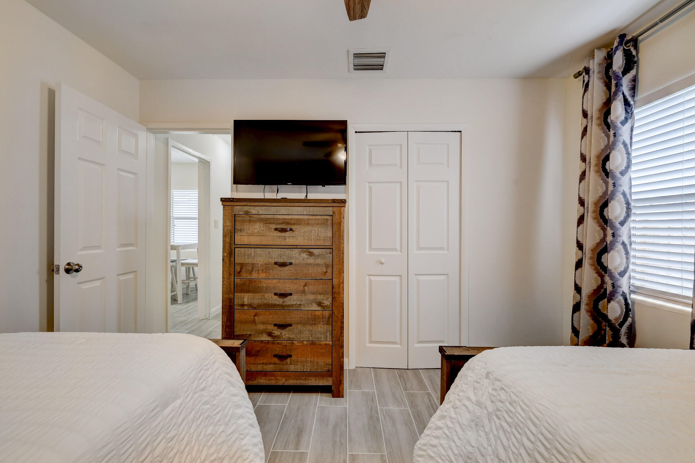 125 South 10th Street Fort Pierce, FL 34950 - Photo 18 of 30 a bedroom with a bed and a television