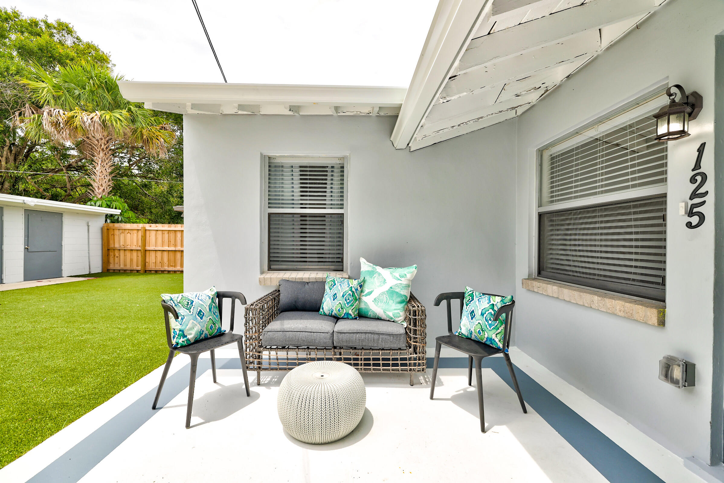 125 South 10th Street Fort Pierce, FL 34950 - Photo 21 of 30 a view of a patio with couches chairs and a yard