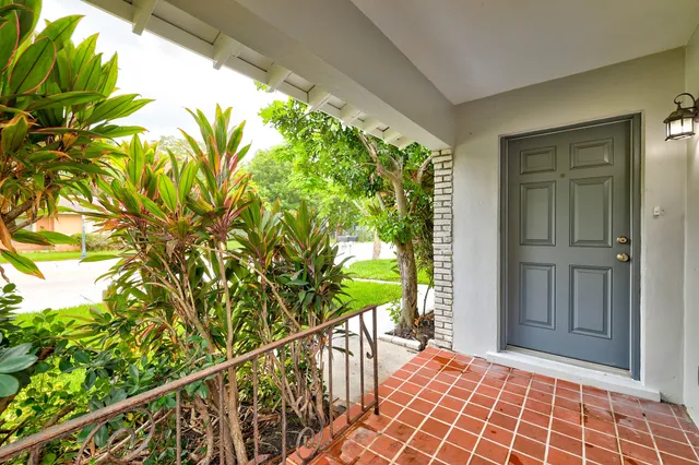a view of balcony with wooden floor