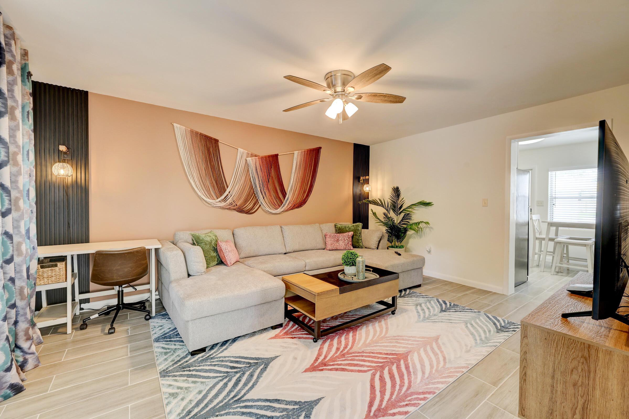 125 South 10th Street Fort Pierce, FL 34950 - Photo 5 of 30 a living room with furniture fireplace and a flat screen tv