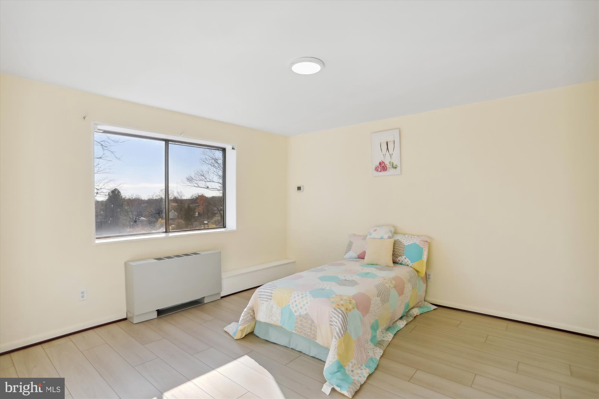 614 Sligo Avenue, Unit 508 Silver Spring, MD 20910 - Photo 20 of 31 a bedroom with a bed and a window