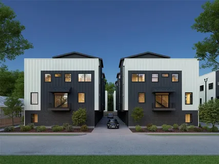 a front view of residential houses with yard