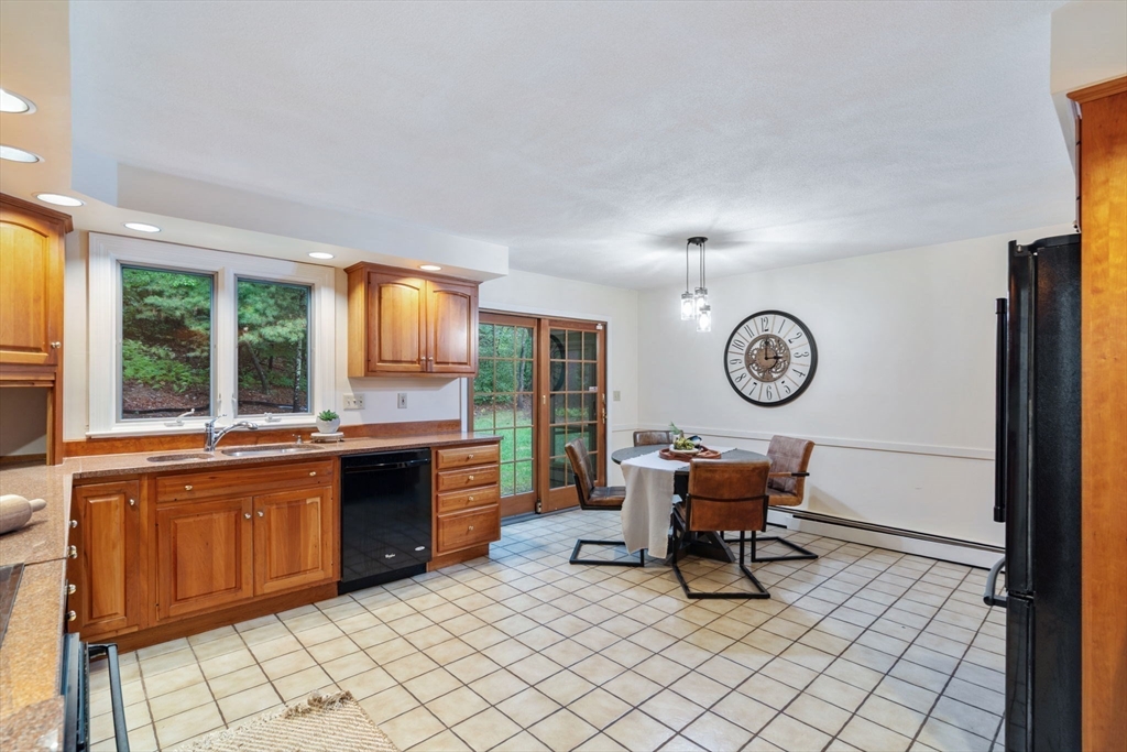 369 Border Road Concord, MA 01742 - Photo 14 of 34 a living room with furniture a window and kitchen view