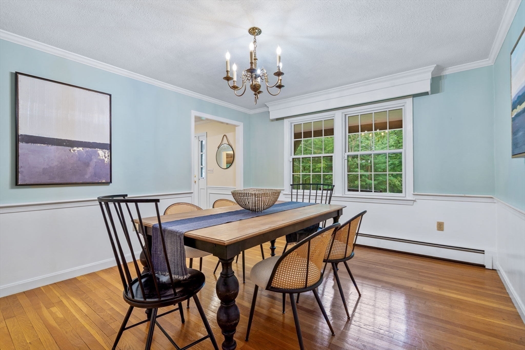 369 Border Road Concord, MA 01742 - Photo 17 of 34 a view of a dining room with furniture window and wooden floor