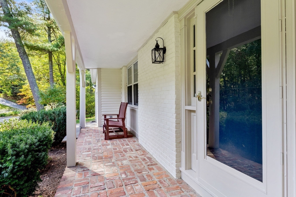 369 Border Road Concord, MA 01742 - Photo 2 of 34 a view of a hallway with outdoor seating