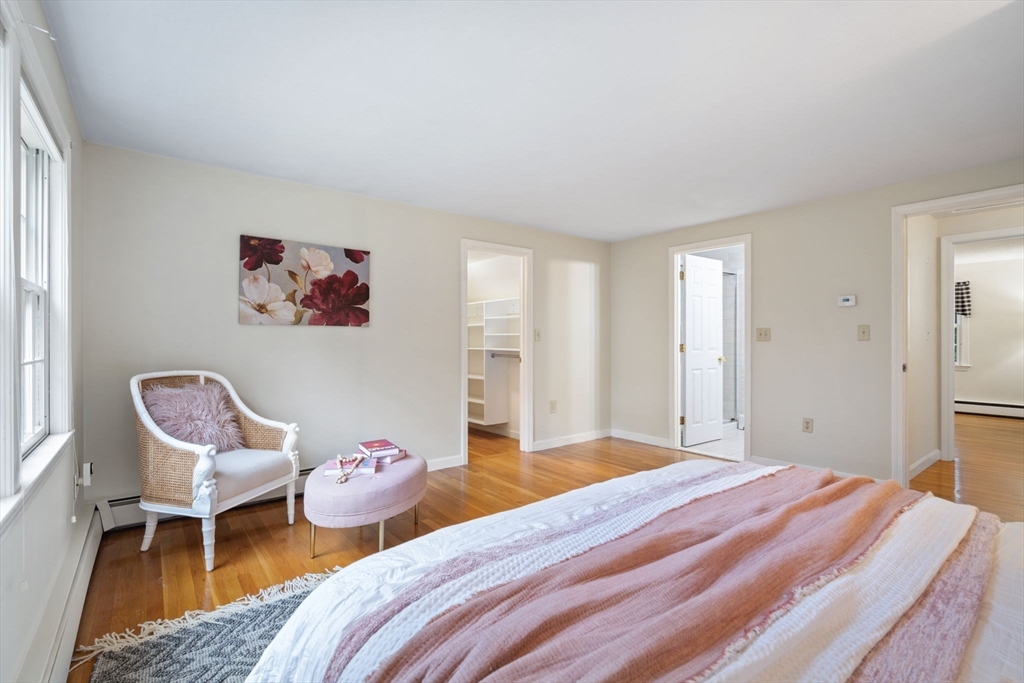 369 Border Road Concord, MA 01742 - Photo 21 of 34 a bedroom with a bed and a chair