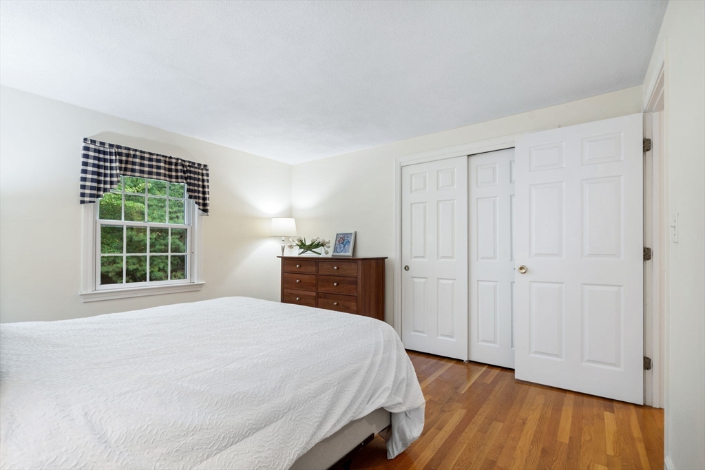 369 Border Road Concord, MA 01742 - Photo 23 of 34 a bedroom with a bed and a window