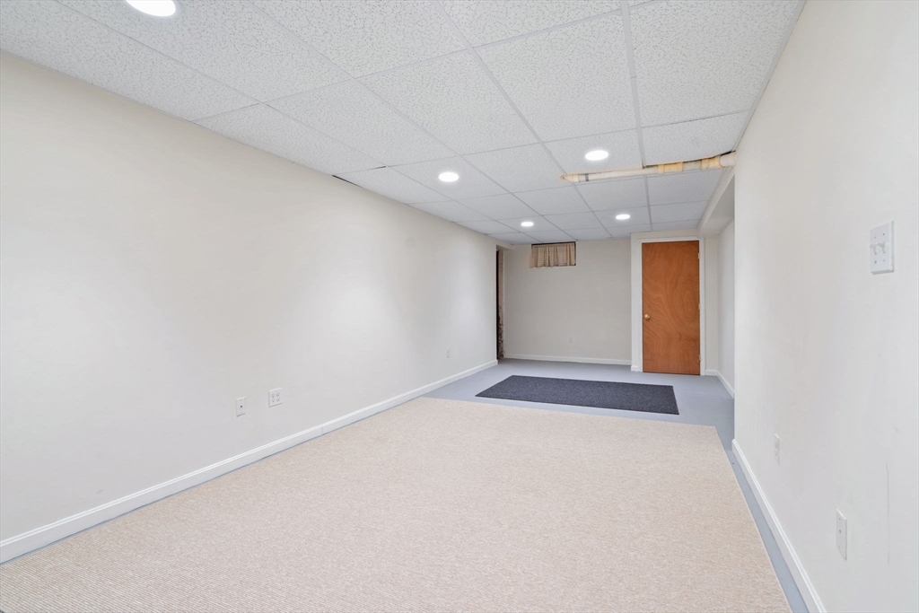 369 Border Road Concord, MA 01742 - Photo 28 of 34 an empty room with a empty space and windows