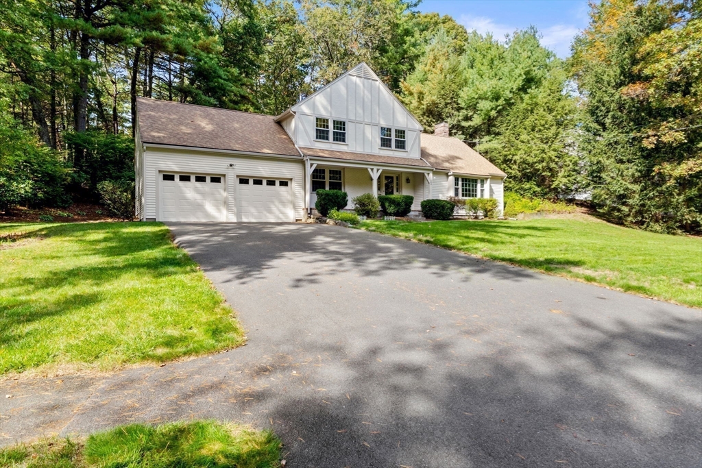 369 Border Road Concord, MA 01742 - Photo 31 of 34 a view of a big house with a big yard and large trees
