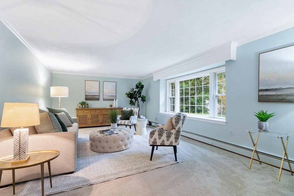 369 Border Road Concord, MA 01742 - Photo 5 of 34 a living room with furniture a lamp paintings and a window