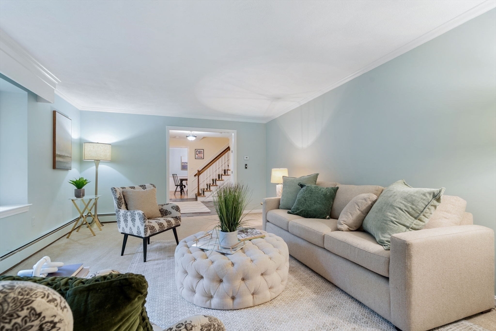 369 Border Road Concord, MA 01742 - Photo 6 of 34 a living room with furniture and a couch