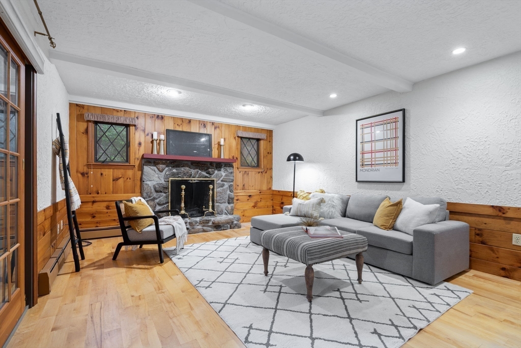 369 Border Road Concord, MA 01742 - Photo 9 of 34 a living room with furniture and a fireplace