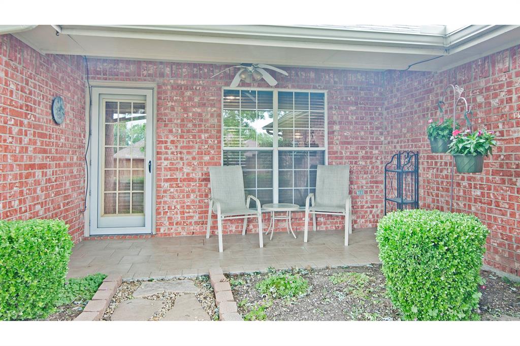 7757 Lancelot Road Frisco, TX 75035 - Photo 4 of 27 Doorway to property featuring brick siding and ceiling fan