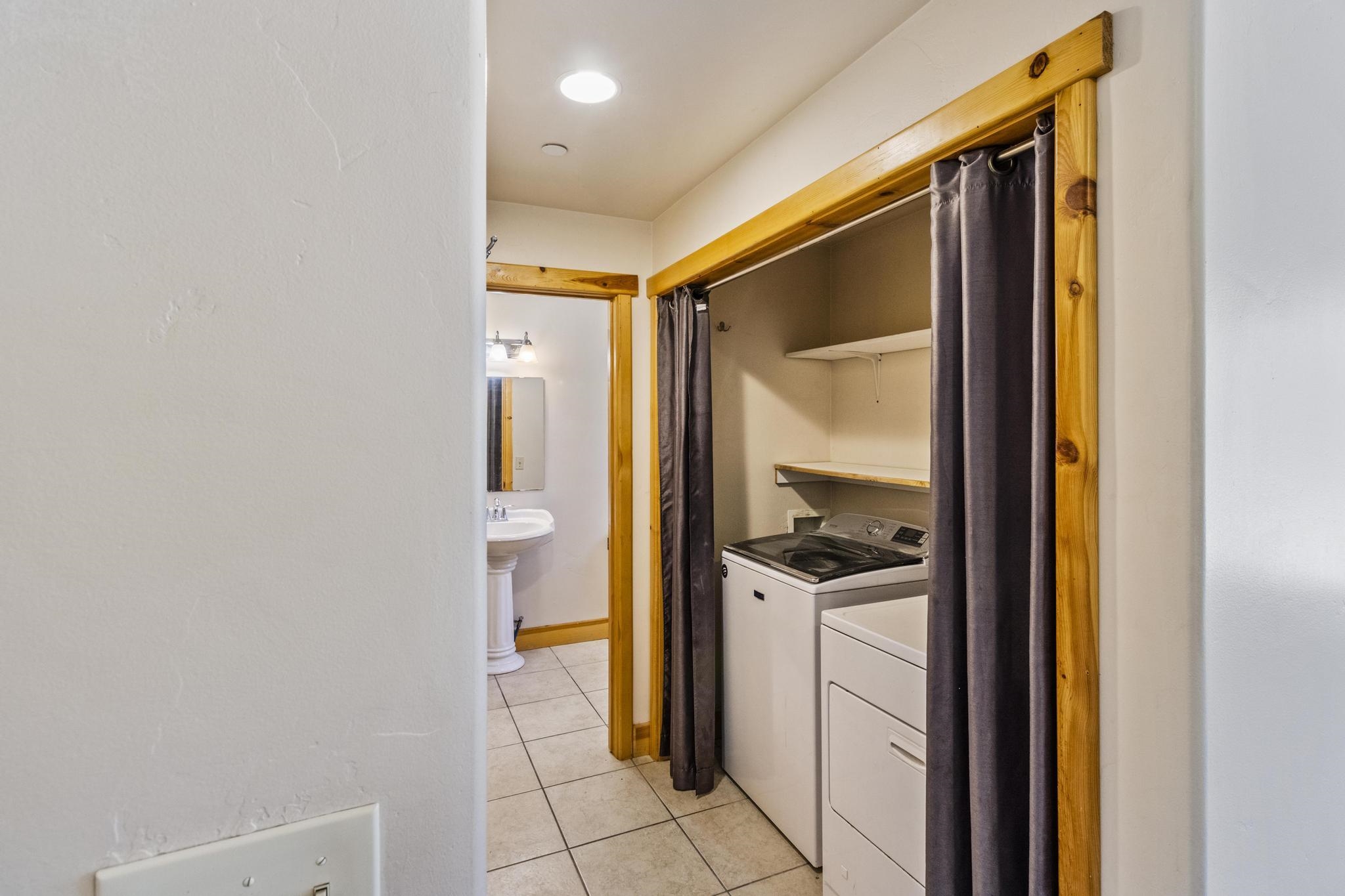 6980 Toyon Road Tahoe Vista, CA 96148 - Photo 10 of 20 a bathroom with a sink and a mirror