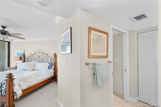 a bedroom with a bed and a lamp