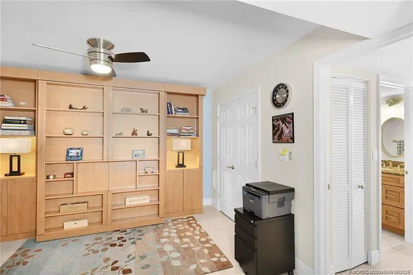 a bedroom with a bed and cabinets