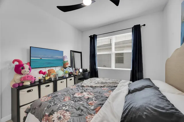 a bedroom with furniture and flat screen tv