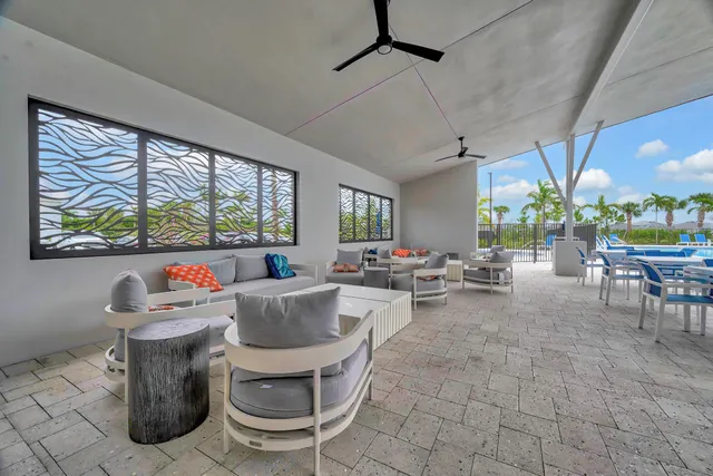 a outdoor space with lots of tables a garden and chairs