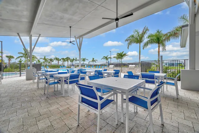 a view of swimming pool with outdoor seating