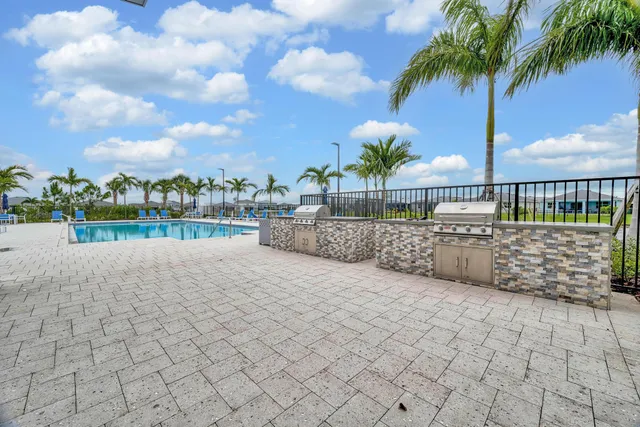 a view of swimming pool with outdoor seating