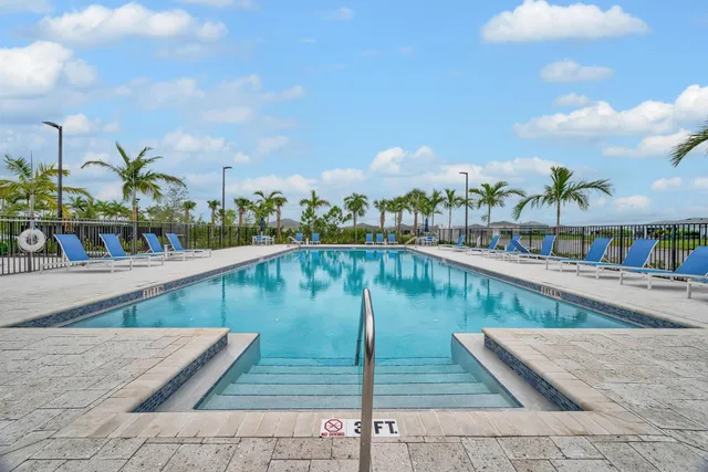 a view of a swimming pool with a sitting space