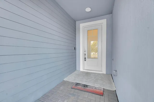 a view of front door and bedroom