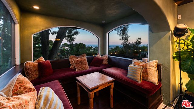 a outdoor living space with furniture and a potted plant