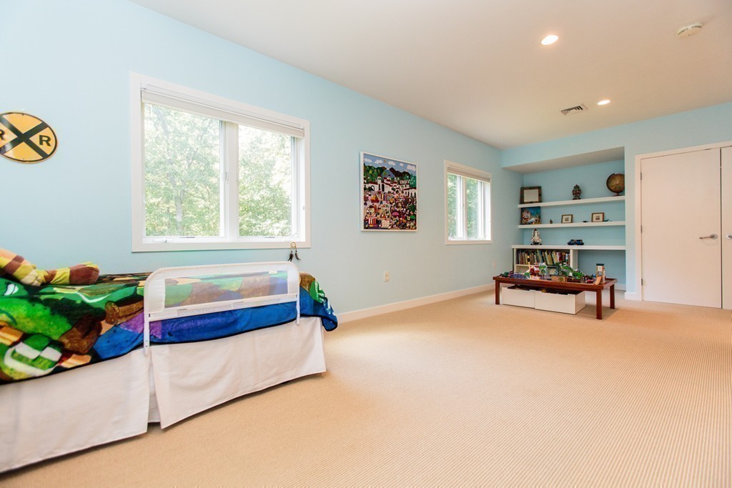 19 Coolidge Road Wayland, MA 01778 - Photo 18 of 29 a bedroom with furniture and a bed