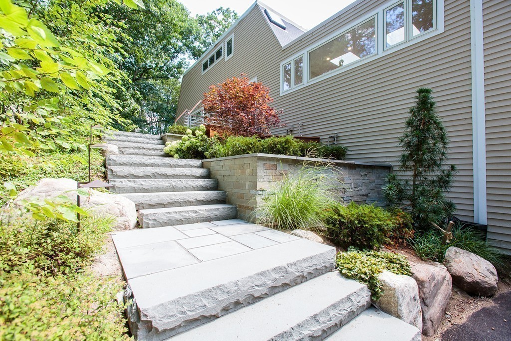 19 Coolidge Road Wayland, MA 01778 - Photo 25 of 29 a view of a house with pool and chairs