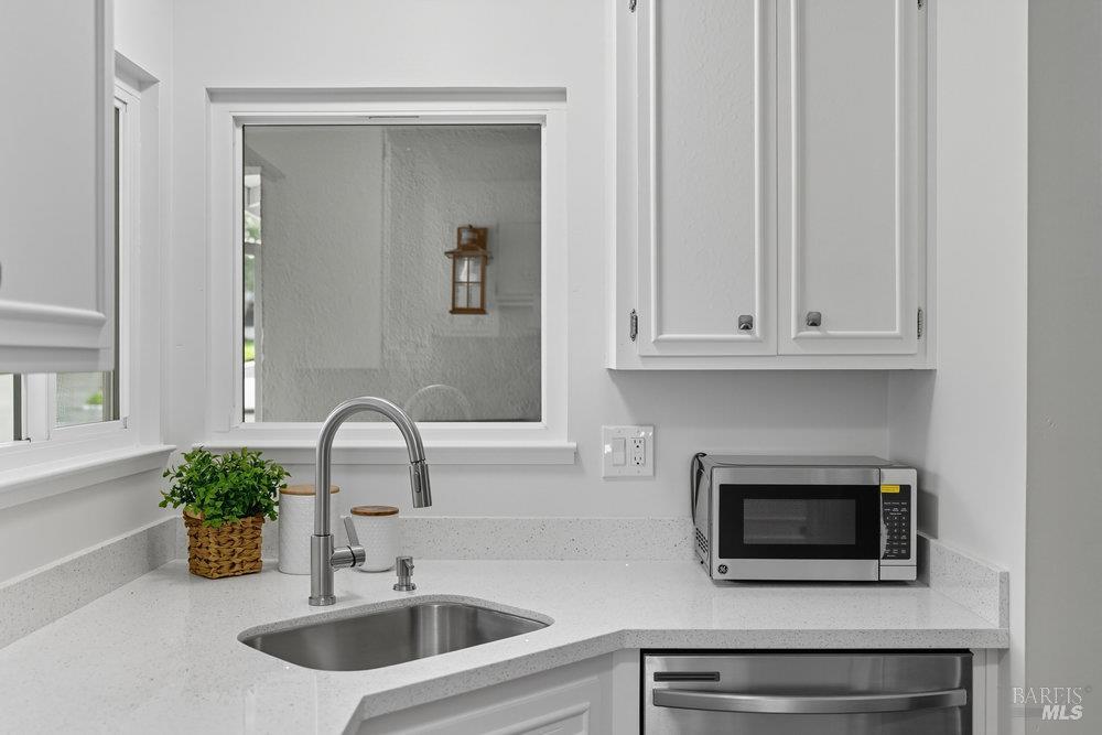934 Las Pavadas Avenue San Rafael, CA 94903 - Photo 17 of 36 a bathroom with a sink and a mirror