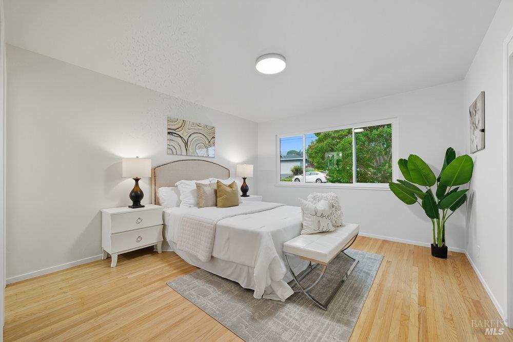 934 Las Pavadas Avenue San Rafael, CA 94903 - Photo 19 of 36 a living room with a balcony furniture and a potted plant
