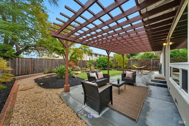 a view of a patio with couches and chairs