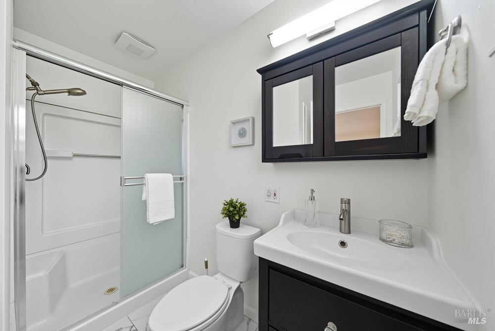 934 Las Pavadas Avenue San Rafael, CA 94903 - Photo 22 of 36 a bathroom with a sink a toilet and shower