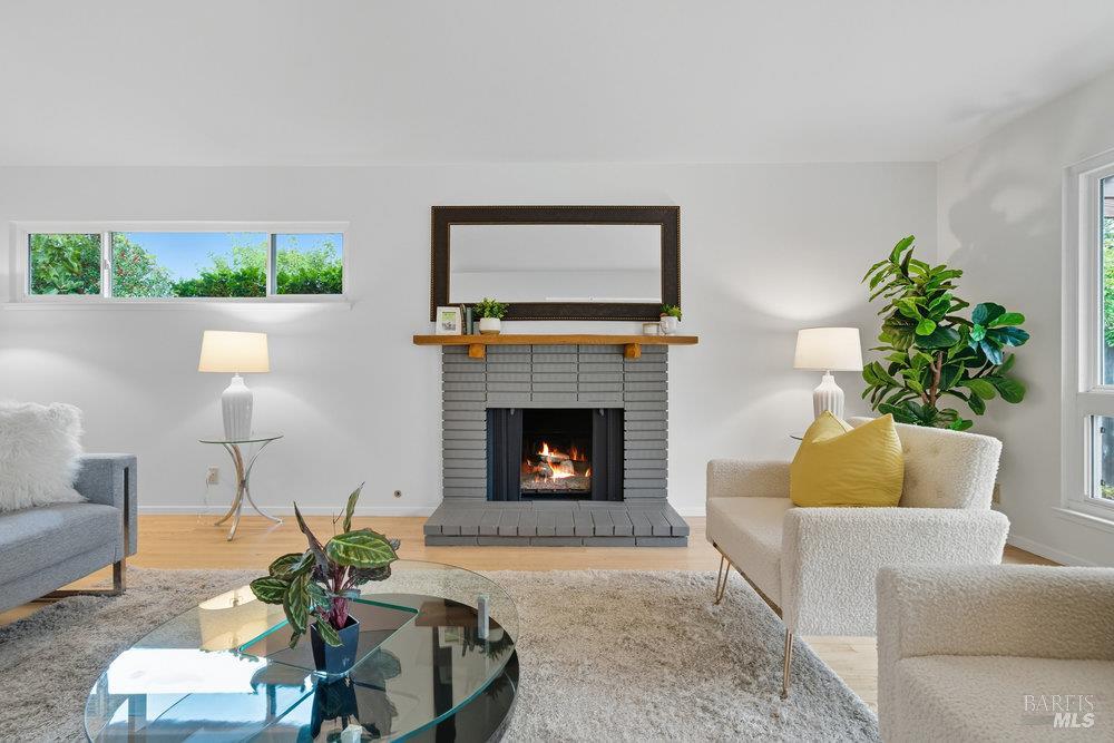 934 Las Pavadas Avenue San Rafael, CA 94903 - Photo 6 of 36 a living room with furniture and a fireplace