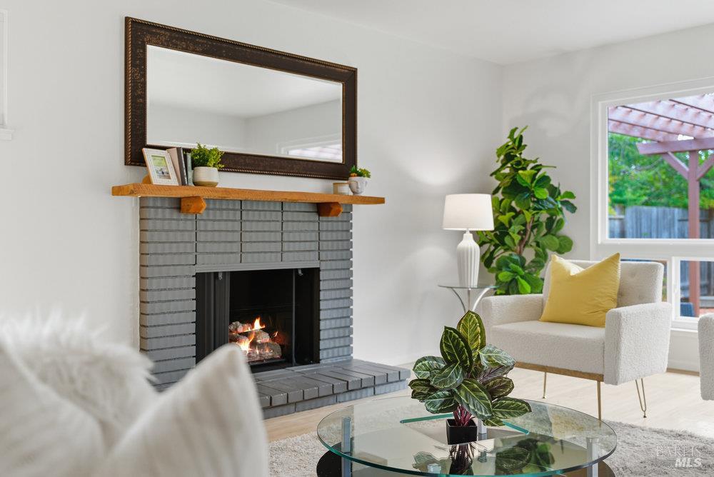 934 Las Pavadas Avenue San Rafael, CA 94903 - Photo 7 of 36 a living room with furniture and a fireplace