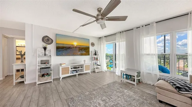 a living room with furniture and flat screen tv