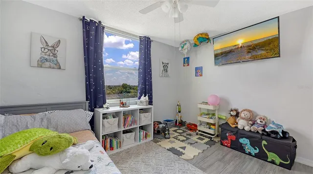 a room with toys and a wooden floor