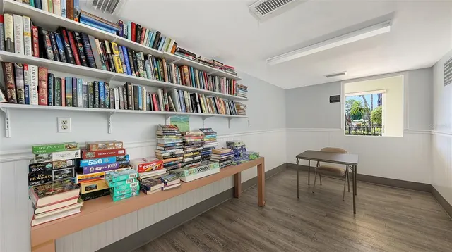 a hallway with a book shelf and a book shelf