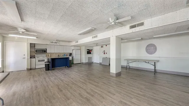 a view of kitchen and hall with furniture