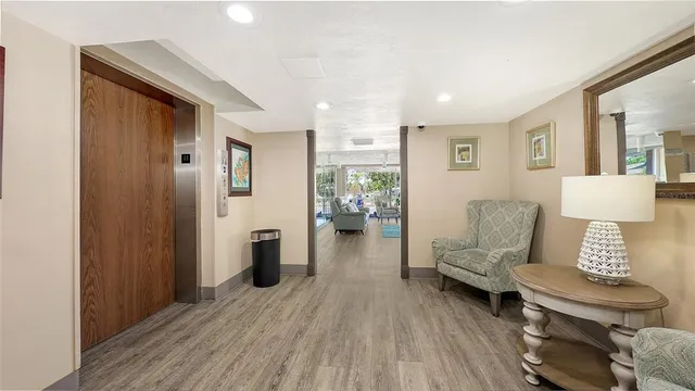 a view of walk in closet with clothes