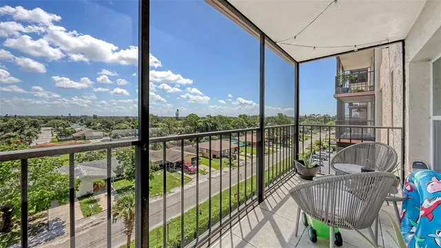 a view of balcony with couches