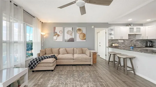 a living room with furniture and a large window